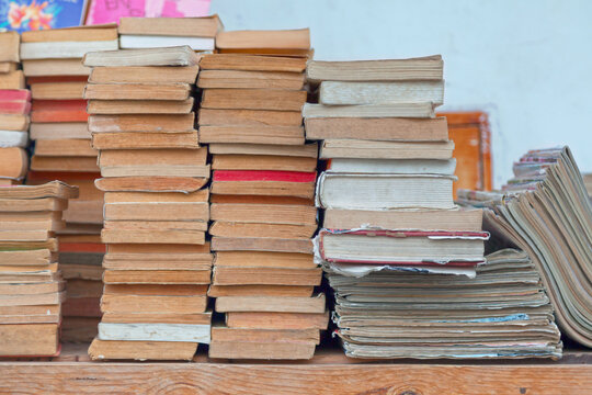 Stacks of used books and magazines for sale
