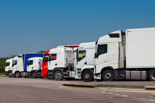 Row of cab over semi-trailer trucks