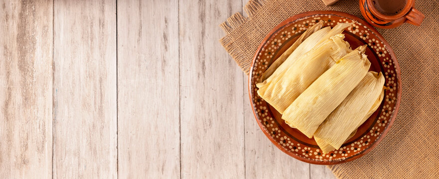 Tamales. Prehispanic dish typical of Mexico and some Latin American countries. Corn dough wrapped in corn leaves. The tamales are steamed.