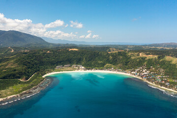 Aerial view of Blue lagoon with sandy beach. Pagudpud, Ilocos Norte, Philippines.