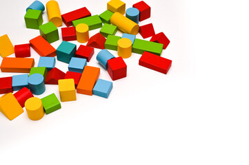 Colorful wooden figurines on a white wooden background. The concept of learning. copy space