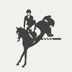 Black and white silhouette of an equestrian athlete and a horse, landing after a jump