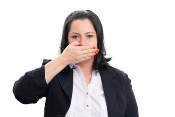 Female corporate covering mouth using hand as secret concept