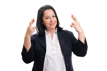 Friendly entrepreneur woman making good luck gesture with hands