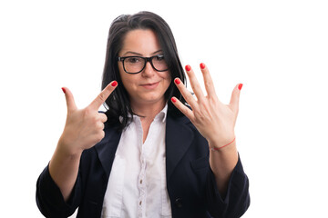 Female entrepreneur showing number seven fingers wearing suit