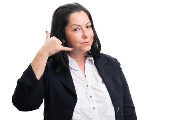 Friendly businesswoman making phone call gesture with fingers