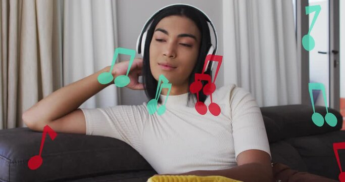 Animation of music notes over biracial woman listening to music with headphones