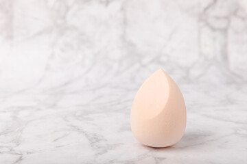 Beauty blender on marble background.Bright sponges for make-up cosmetics. Makeup products. Beauty concept. Place for text. Space for copy. Flat lay