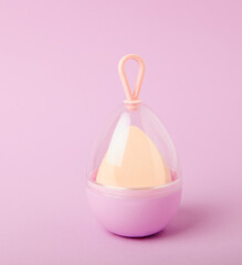 Beauty blender on lilac background.Bright sponges for make-up cosmetics. Makeup products. Beauty concept. Place for text. Space for copy. Flat lay
