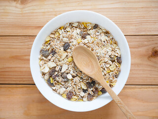A Bowl of muesli breakfast and rolled oats with dried fruits