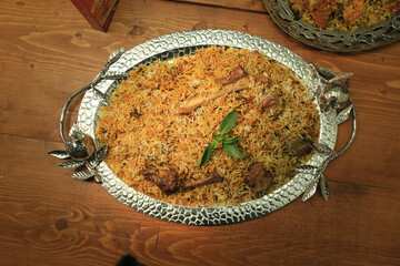 bombay biryani in white plate, Traditional spicy indian food, Iftar meal, Ramadan dinner on white background.
