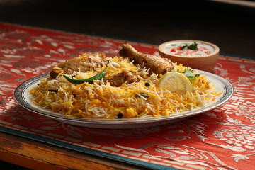 bombay biryani in white plate, Traditional spicy indian food, Iftar meal, Ramadan dinner on white background.

