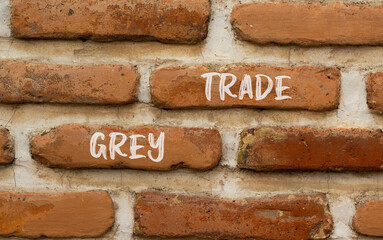 Grey trade symbol. Concept words Grey trade on red brown brick wall. Beautiful red brown brick wall background. Business grey trade concept. Copy space.