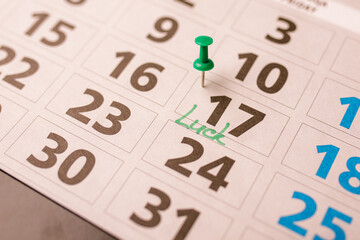 Calendar closeup with text Luck on 17 March - Happy Saint Patrick's day