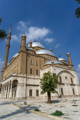Exterior of the Alabaster Mosque in the Saladin Citadel in Cairo, on a sunny day.