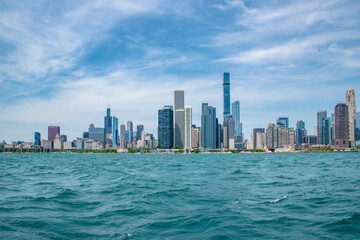 Fototapeta na wymiar Chicago City Skyline and Coastline Along Lake Michigan on Sunny Day With Blue Sky