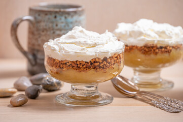 Closeup of two individual servings of apple compote dessert.