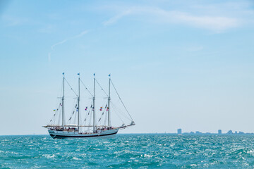Fototapeta na wymiar Old Classic Pirate Ship Yacht Sailboat on Lake Michigan With Blue Sky
