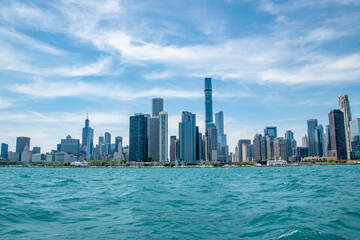 Fototapeta na wymiar Chicago City Skyline and Coastline Along Lake Michigan on Sunny Day With Blue Sky