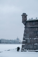 Fototapeta premium Snow-covered walls of an ancient fortress in winter.