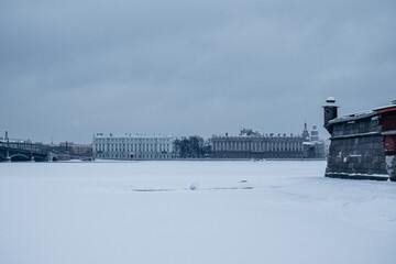 Bridge over the river and embankment in winter in a big city.