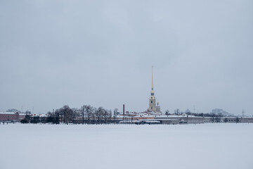 Bridge over the river and embankment in winter in a big city.