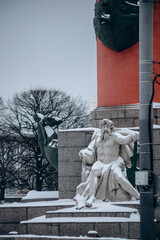 Fototapeta premium Rostral column vintage on the embankment with sculptures.