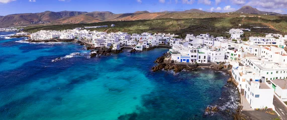 Foto op Canvas Canary islands travel. Lanzarote scenic places. Charming  Punta Mujeres traditional fishing village. aerial drone view. popular  for natural swim pools. © Freesurf