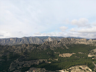 Limestone rock ridge Els Castellets, Sella.Looking North West from Puig Campana to Penya Sella and Sierra de Aitana, Finestrat, Alicante province,Spain