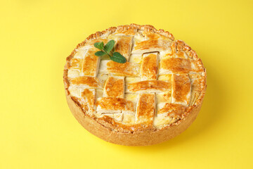 Neapolitan typical easter cake: pastiera on yellow bakground