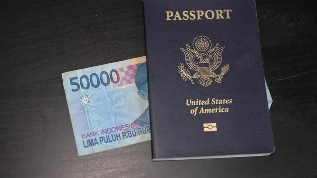 American passport with Indonesian money