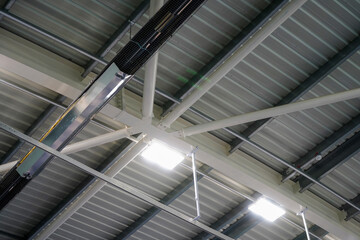 Looking up at a roof of a sports hall