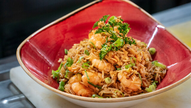 A Bowl Of Freshly Prepare Oriental Style Prawn Fried Rice Served In A Red Bowl