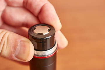 Batteries are inserted into the electronic device. The concept of powering technical gadgets.