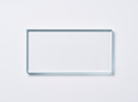 Glass square shapes on a light background.