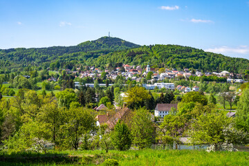 Jedlova Mountain and Jiretin pod Jedlovou town on sunny day. Lusatian Mountains, Czech Republic