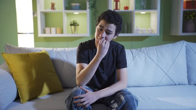 The frightened, worried young man is uneasy and unhappy because of his wrongdoing.
Young male doing risky business looking around with fearful and worried eyes.
