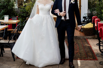 the bride in a white wedding dress with the groom in a suit