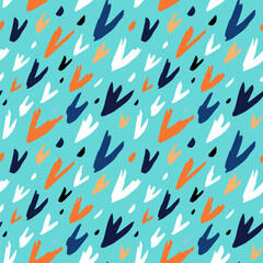 Colored pattern on a blue background. Abstract brush strokes drawn by hand. Seamless vector image.
