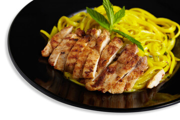 Linguine Pasta With Grilled Chicken on a Black Plate Isolated White Background Close Up PNG File