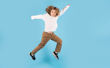 Funny boy jumping. Full length photo of kid boy jump high wear casual checkered shirt isolated on...