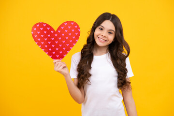 Happiness kids and love concept. Romantic lovely teen girl with red heart, world heart day, happy valentines day. Happy teenager, positive and smiling emotions of teen girl.