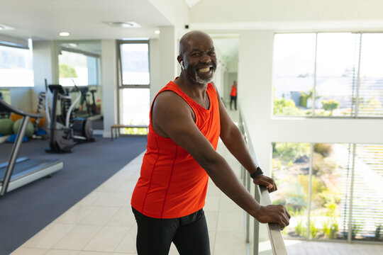 Portrait of african american senior man smiling at the gym