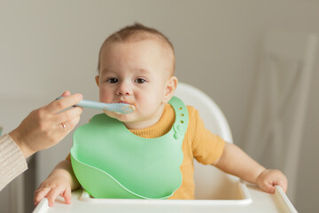 the kid does not want to eat food on the table