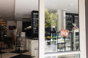 Close up of front door of cafe with open sign