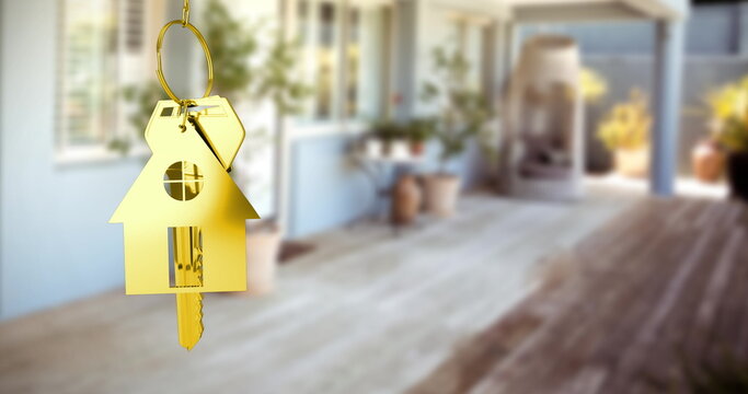 Composition of key with house keychain over house