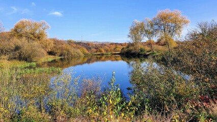 autumn landscape with lake and sky