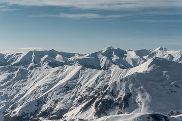 winter mountains at ski resort of caucasus Gudauri, sunny snowy day