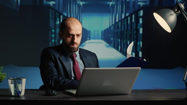 IT infrastructure specialist working in render farm, creating online networking system for digitalization. Network engineer using hardware and web storage in modern data center.
