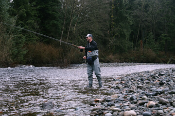 man salmon fishing in the river